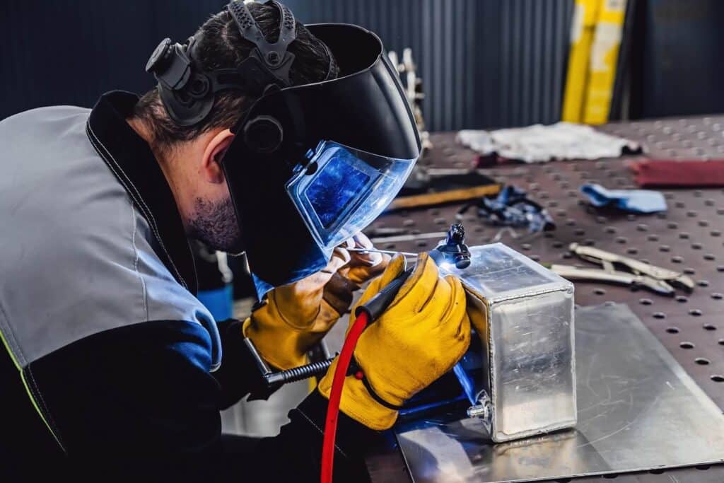 man welding metal